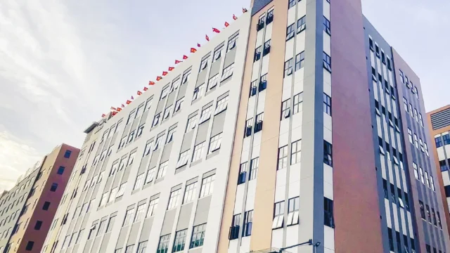 Exterior of the Dongguan plant pictured in Aspire's official brand-history archive.