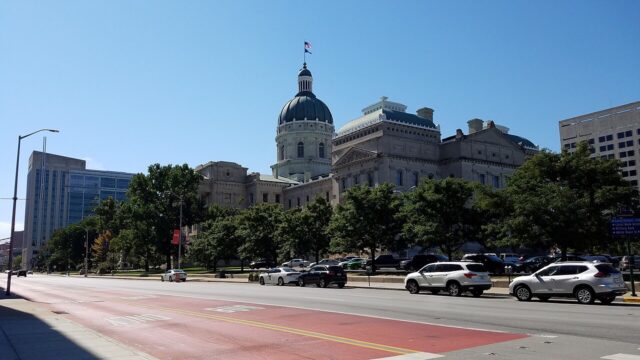 Indiana Statehouse in Indianapolis beneath a blue sky, photographed in October 2021