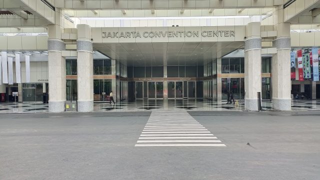 The entrance to Jakarta Convention Center with its name above the doors