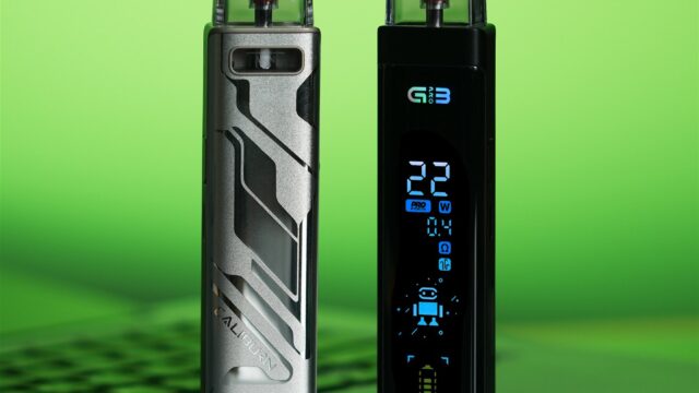 Two UWELL CALIBURN G3 Pro devices photographed on a laptop, showing the display and rear panel.