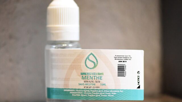 An e-liquid bottle with a printed label
