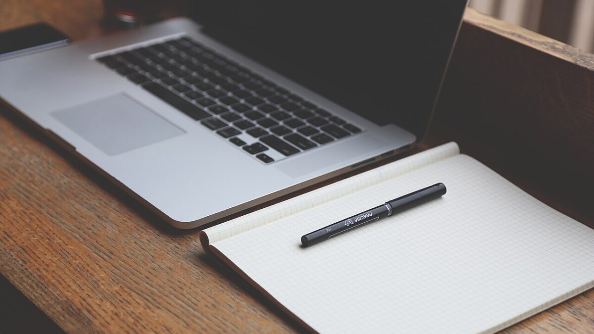 Laptop, notebook and pen in a 2014 archive photograph