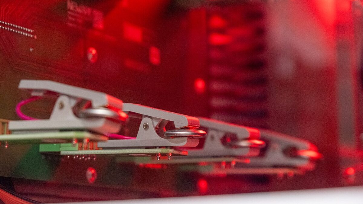 Coin cells mounted in a laboratory testing fixture in January 2026