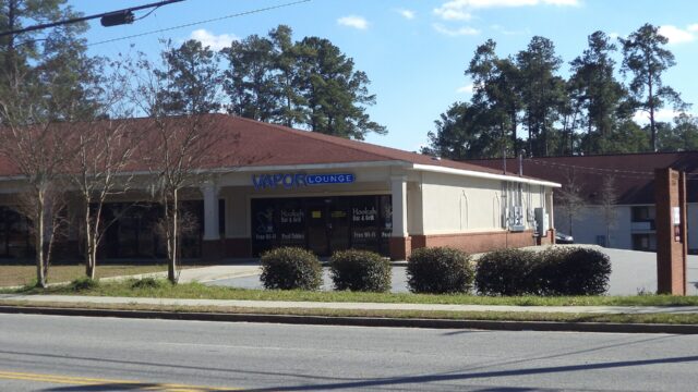 Storefront of a vape shop in a single-storey strip building in Valdosta, Georgia